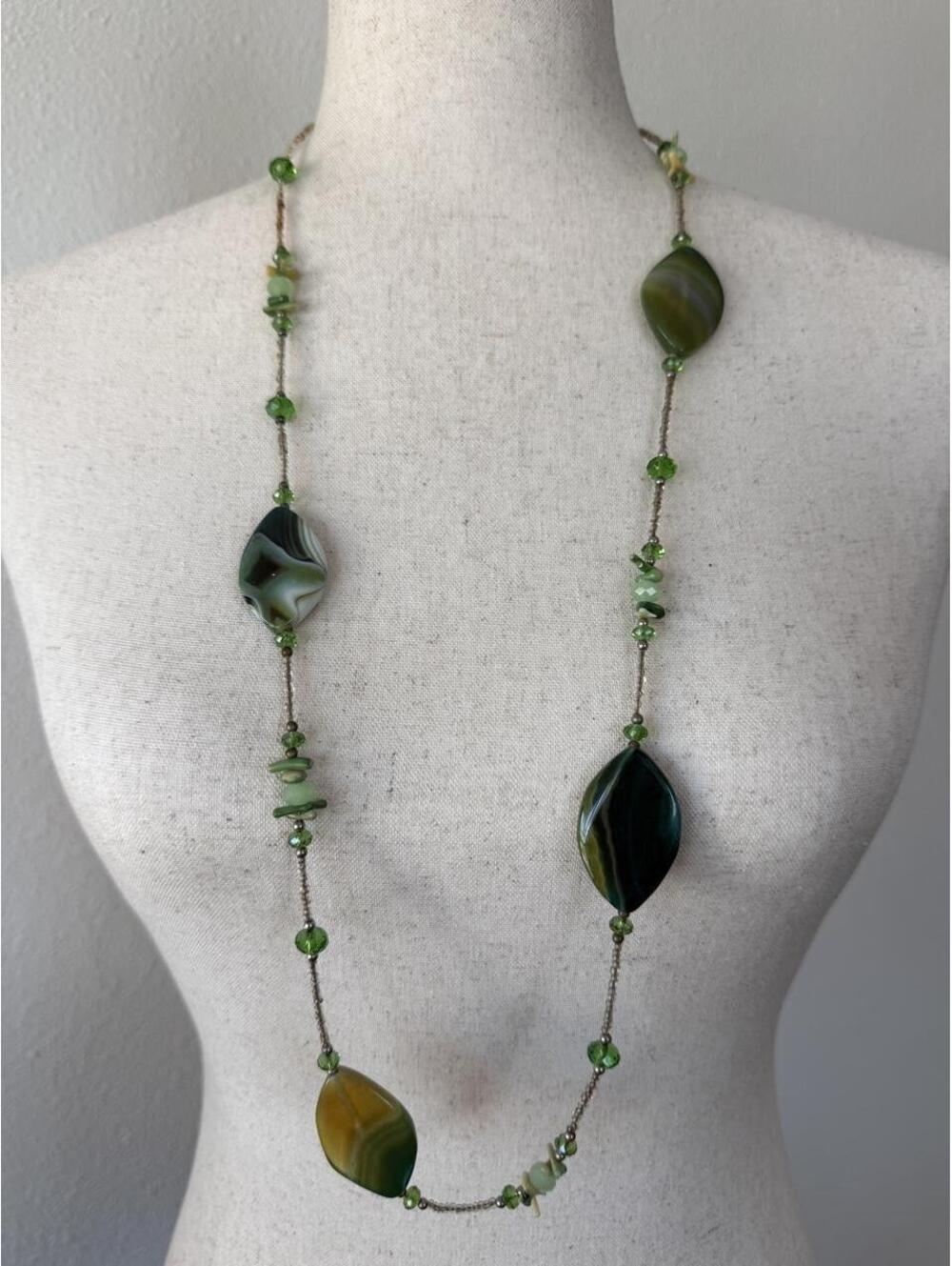 Green goddess energy with a side of thrift-store treasure hunter.